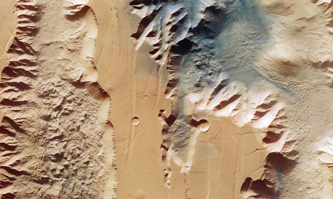 Ius and Tithonium Chasmata canyons in the massive Valles Marineris system on Mars.