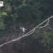 watching a man walk on a rope between two high peaks 118022