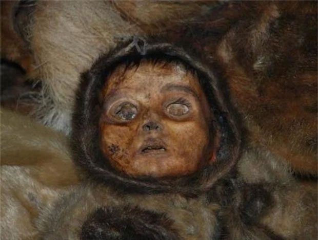 A 6-month-old baby boy who likely was buried alive with his mother.