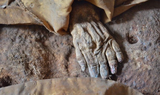Close-up of the child with hands on belly.