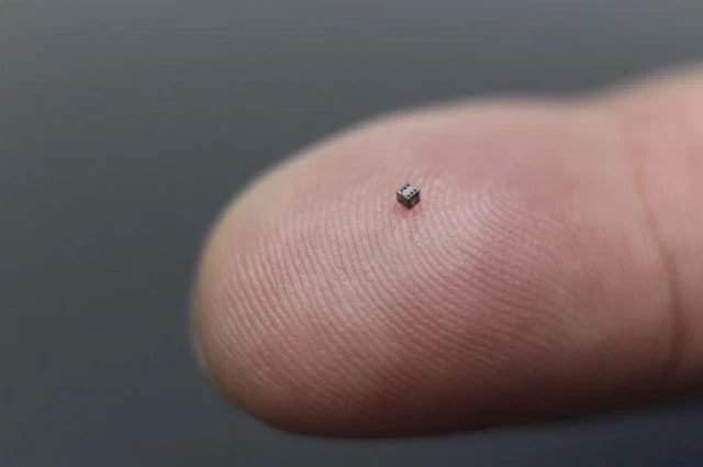 The die is so small it resembles a grain of sand on a human fingertip.