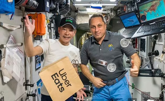Yusaka Maezawa delivering food for the order from beyond Earth.