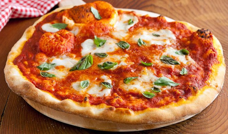 Margherita pizza represents the three colors: green, white, and red of the Italian flag.