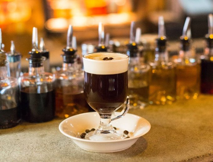 Everyone enjoys a cup of Irish coffee, consisting of hot coffee, whiskey, sugar, and whipped cream.