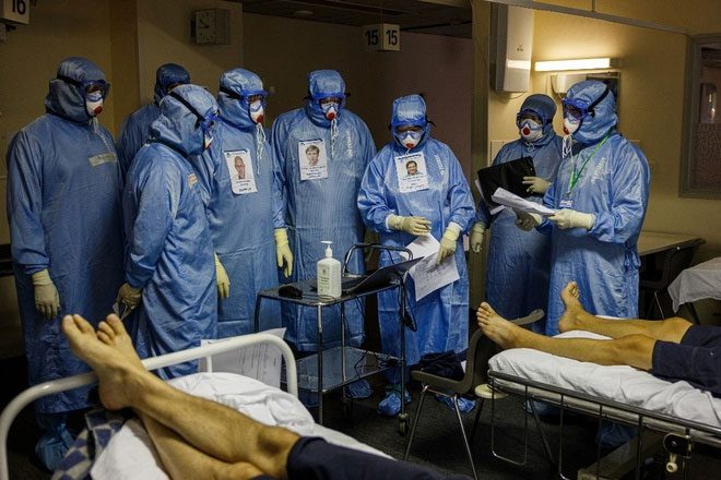 Healthcare workers caring for Covid-19 patients at Sklifosovsky Hospital, Moscow.