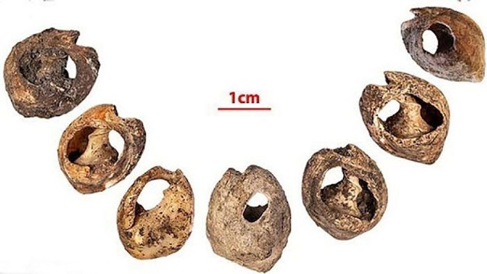 Each bead measures about 1 cm and has a round hole.