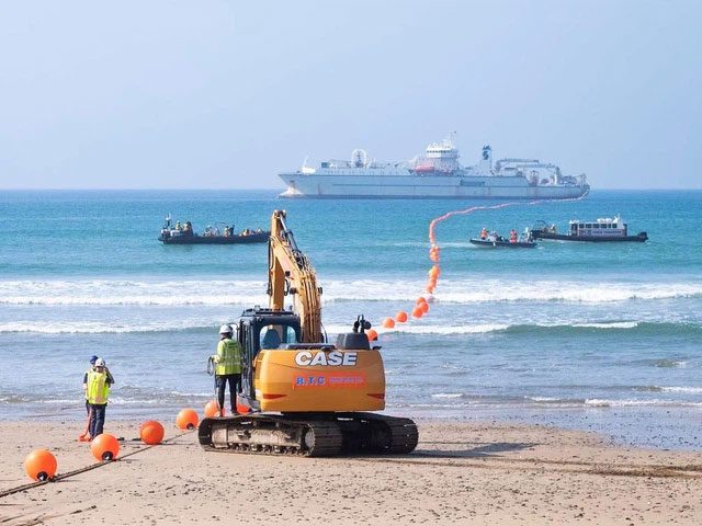 When reaching the destination, the cable-laying ship cannot approach the shore.