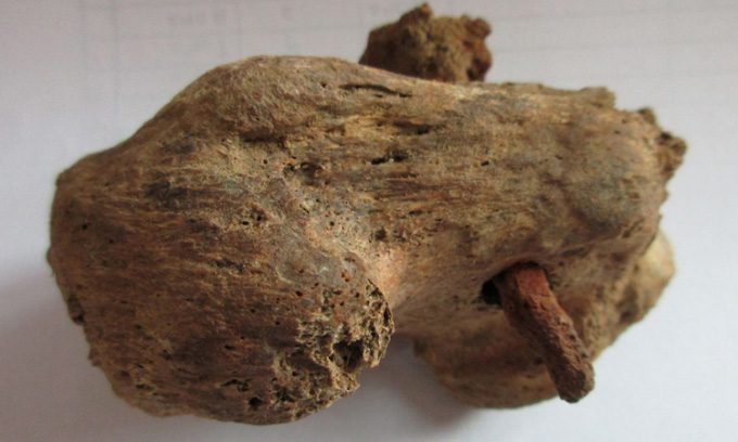 The nail piercing through the heel bone, evidence that the man suffered torture.