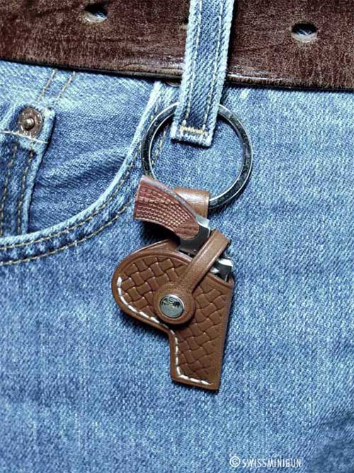 The gun is housed in a stylish leather case.