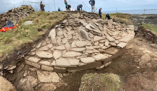 Archaeologists excavating the Neolithic tomb.