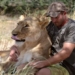 lion dressed in silk hugging a rescuer leaves the world in awe 117839