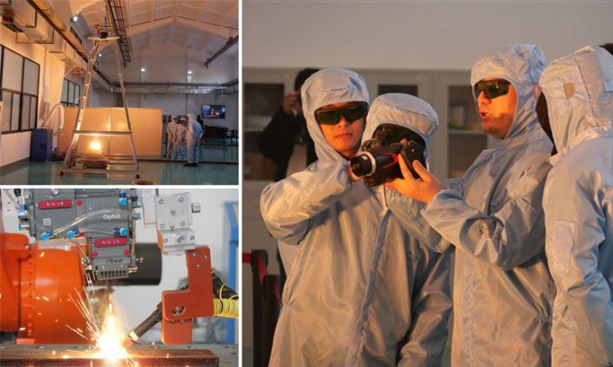 Research team testing the 100 kW laser for welding and glass solidification.
