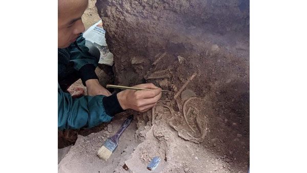 Image of the area where the child's burial was discovered, buried in a curled-up position at the Bat Cave site, Vu Le Commune, Bac Son District