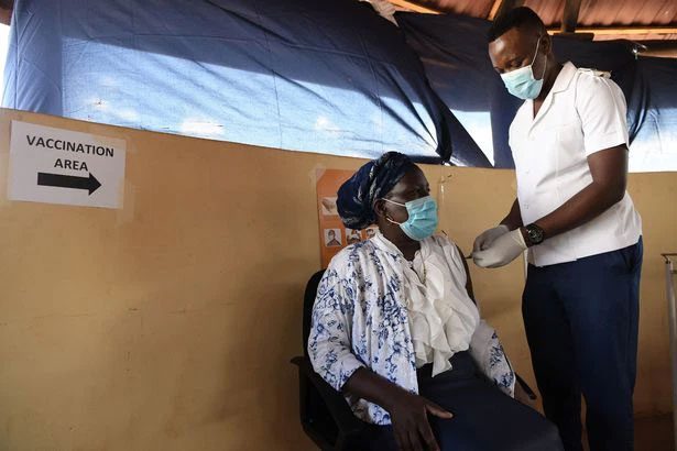 A healthcare worker administering the Oxford/AstraZeneca vaccine in Francistown, Botswana.