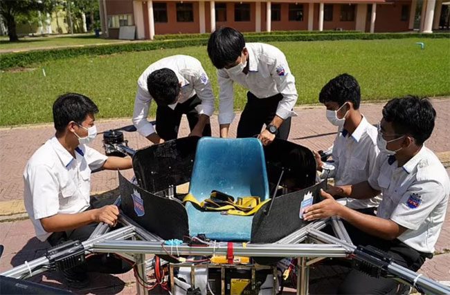 Cambodian students with the flying device they created.