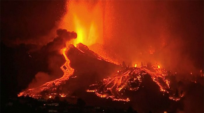 Lava erupting from a volcano in Cumbre Vieja National Park at El Paso