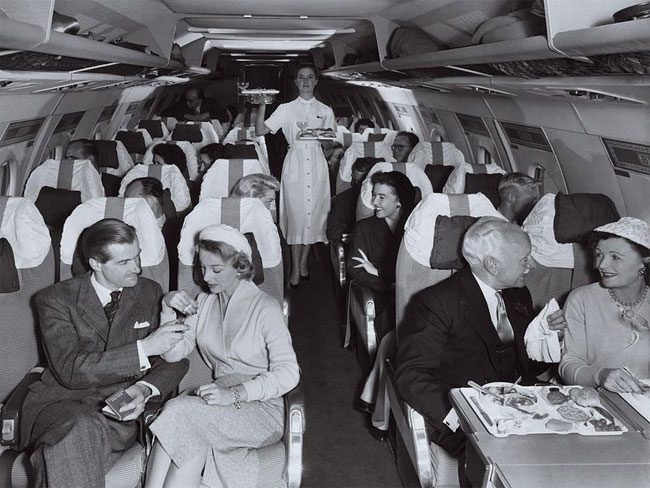 Passengers being served food on a Vickers Viscount airplane