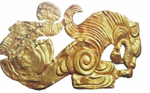An exquisitely crafted gold plaque.