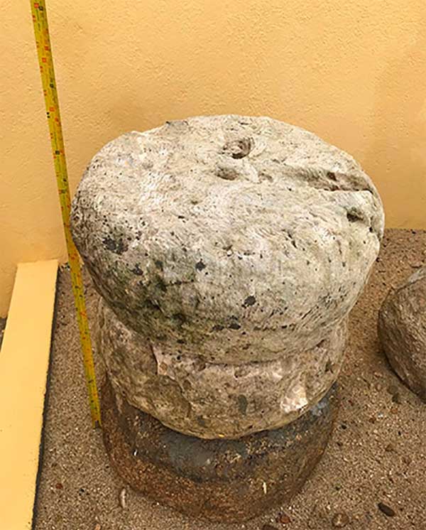 Ancient stone used as a column base.