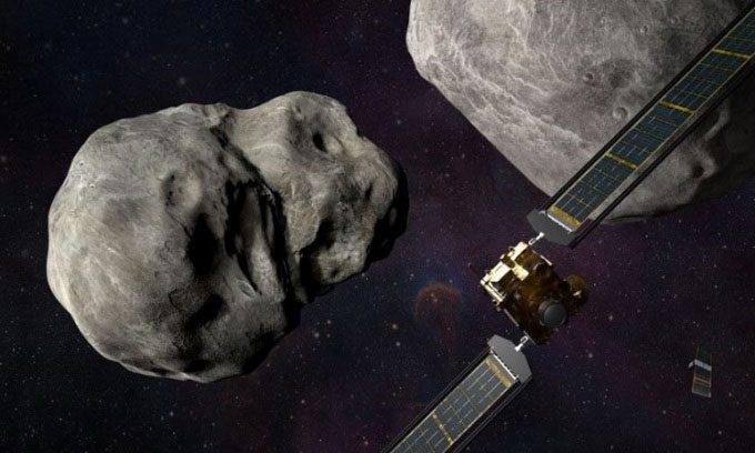 Simulation of the DART spacecraft and cubesat satellite in the Didymos asteroid system.