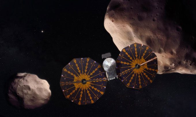 Illustration of the Lucy spacecraft studying asteroids.