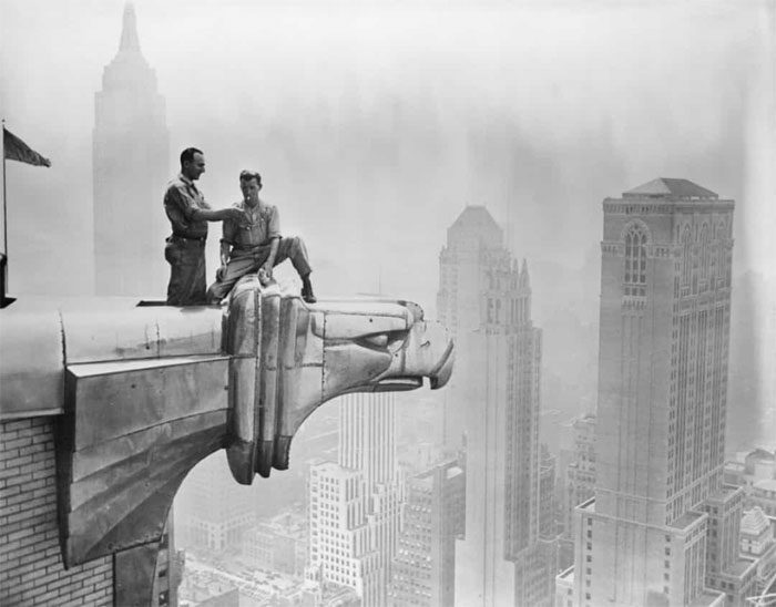 Workers on a gargoyle at the Chrysler Building in New York City, USA