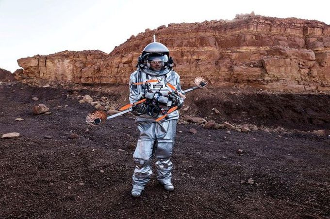 A scientist with a drone prepares to participate in the experiment.