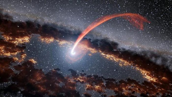 Light from the star being torn apart before being consumed by the black hole.