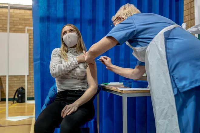 A woman receiving a Covid-19 vaccination in the UK.