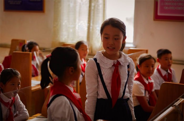Two female students practicing speaking foreign languages at a school near Mangyongdae district