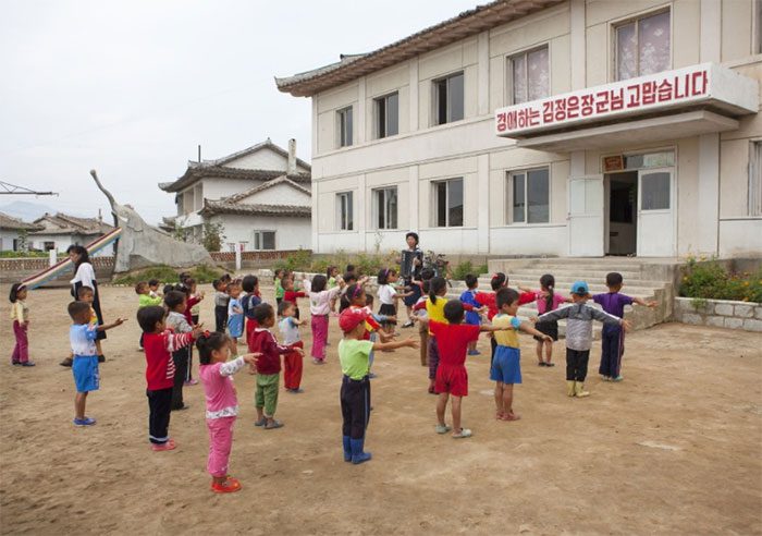 Students exercising to accordion music in the morning