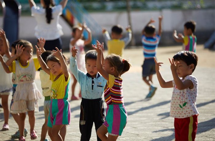 Children dancing and singing at a school near Nampo.