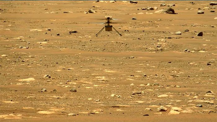 Ingenuity helicopter flying on Mars.